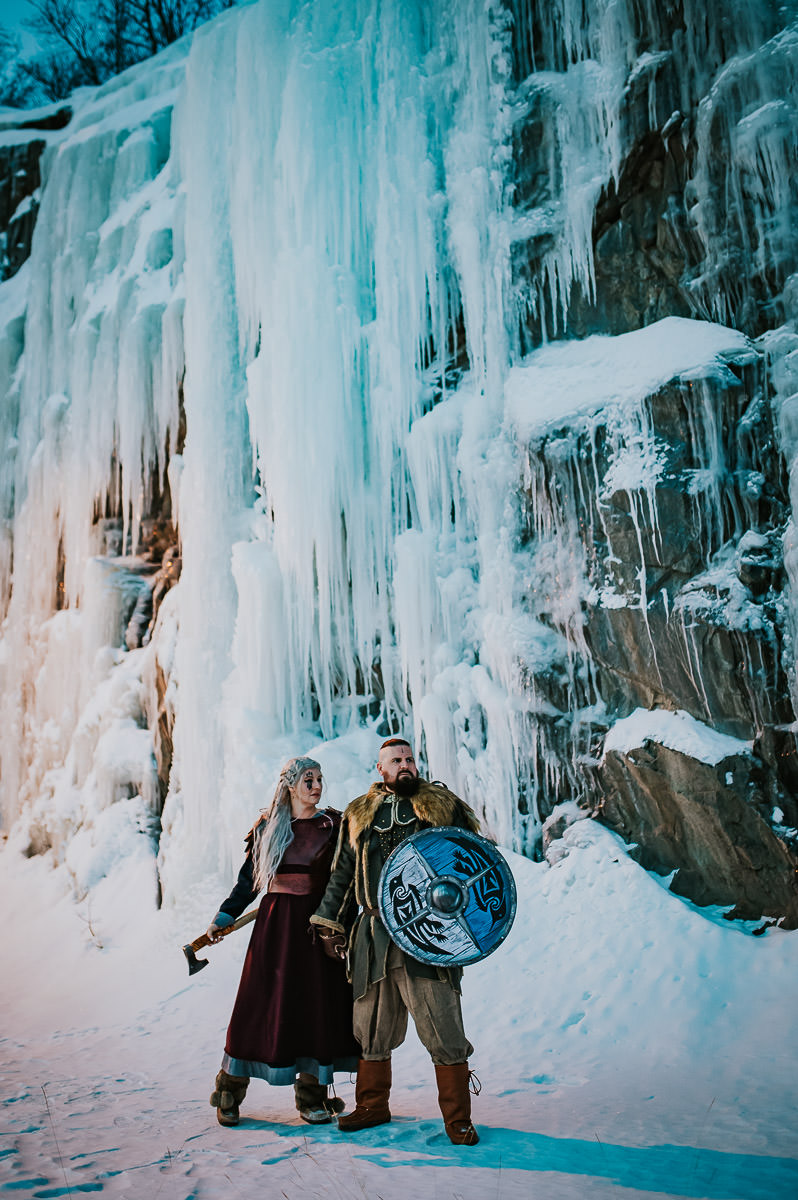 Viking style wedding anniversary by the frozen waterfall in Alta Norway by elopement photographer TS Foto Design