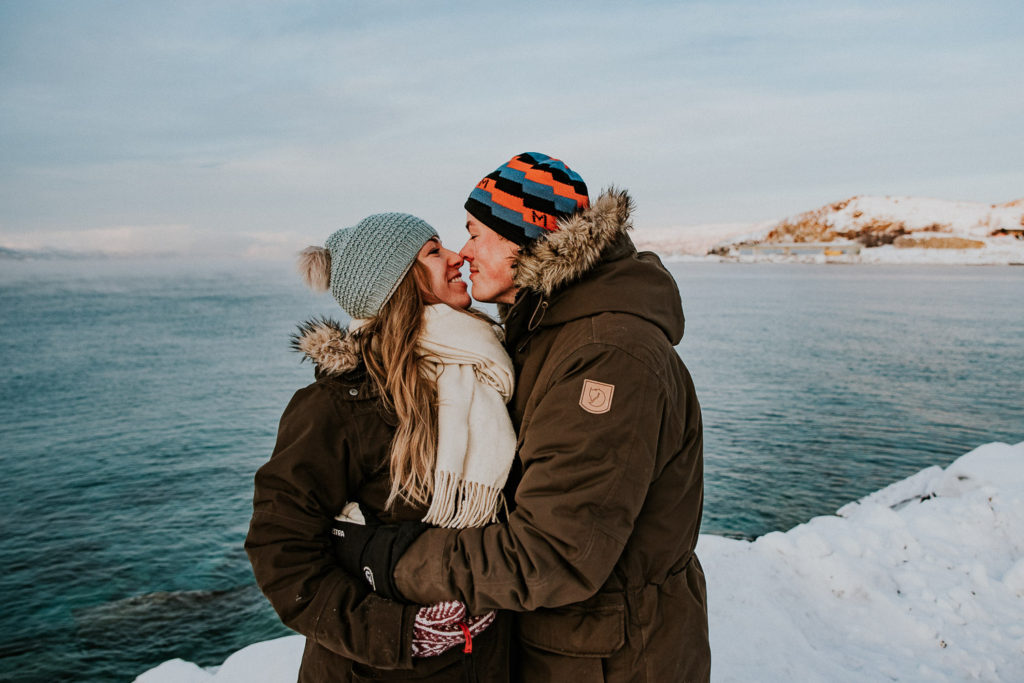 Stunning couple winter engagement session by the fjords Norwegian sea