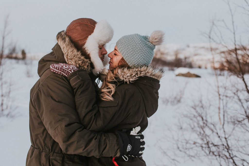 Lovely couple kissing and cuddling during engagement session in ALta Norway Norge Finnmark
