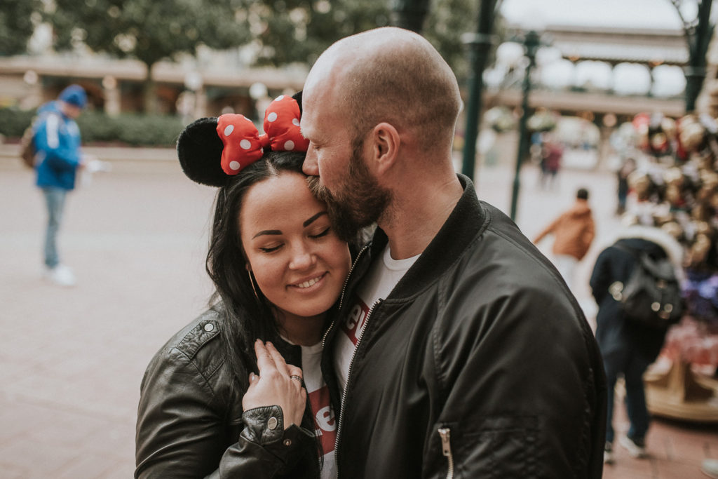 A beautiful couple is enjoying their time in Disneyland in Paris - couple honeymoon photoshoot the day after wedding