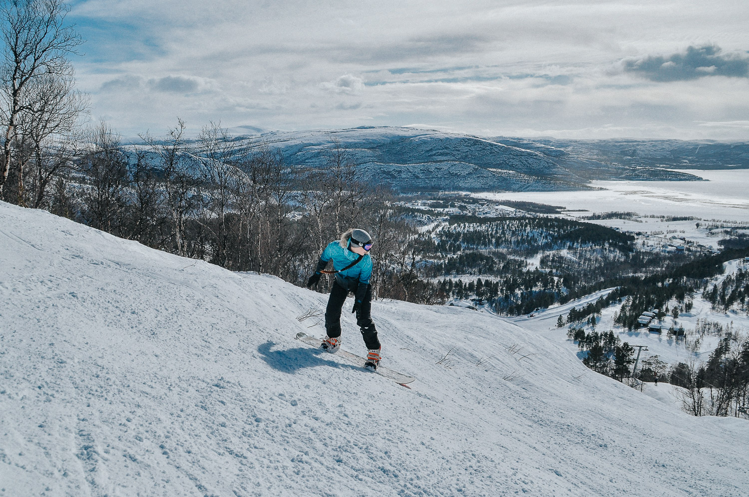 Girl snowboarding in Norway