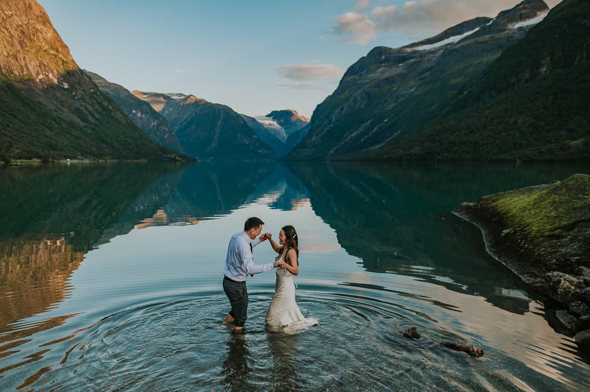 Beautiful couple in the middle of a glacier lake on the day of their elopement in Loen Norway
