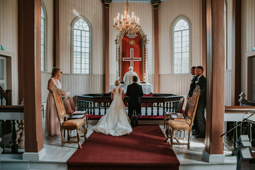 Senja wedding photographer captured Norwegian wedding ceremony in Lenvik church in Finnsnes Troms