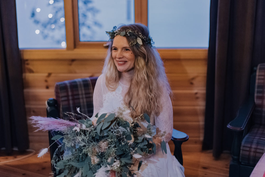 Sweet winter bride ready for her wedding day in ice hotel in Alta Norway