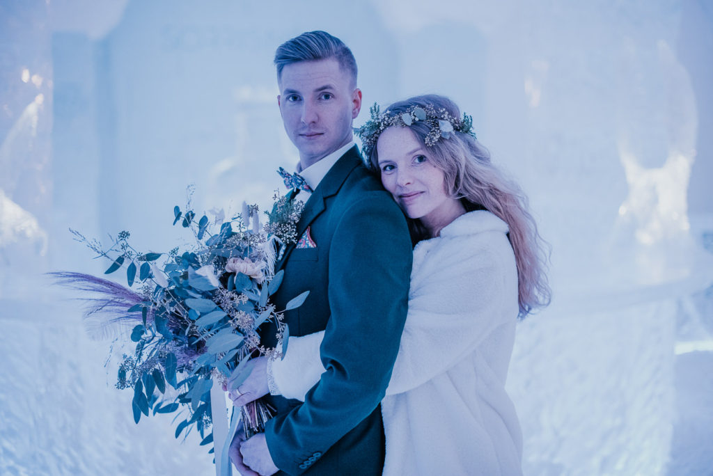 Bridal portrait in the ice hotel in a beautiful winter light