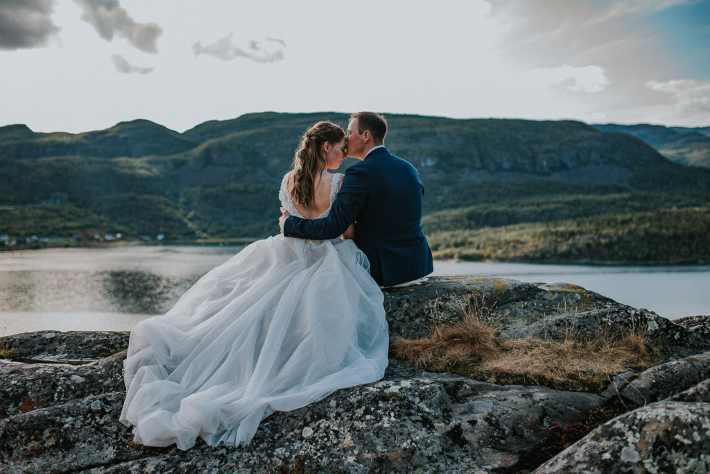 Beautiful couple enjoying views of mountains and fjords in Alta Norway - elopement photographer TS Foto Design