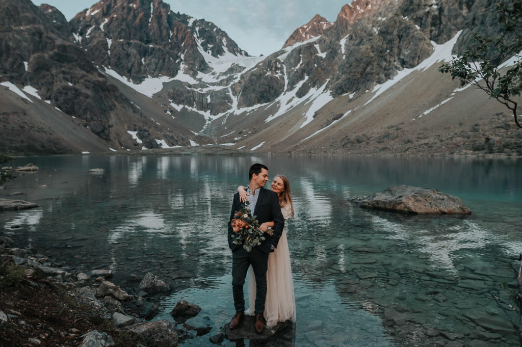 Norway elopement photographer captured an Adventure elopement by the alpine lake in Lyngen Alps in Norway  