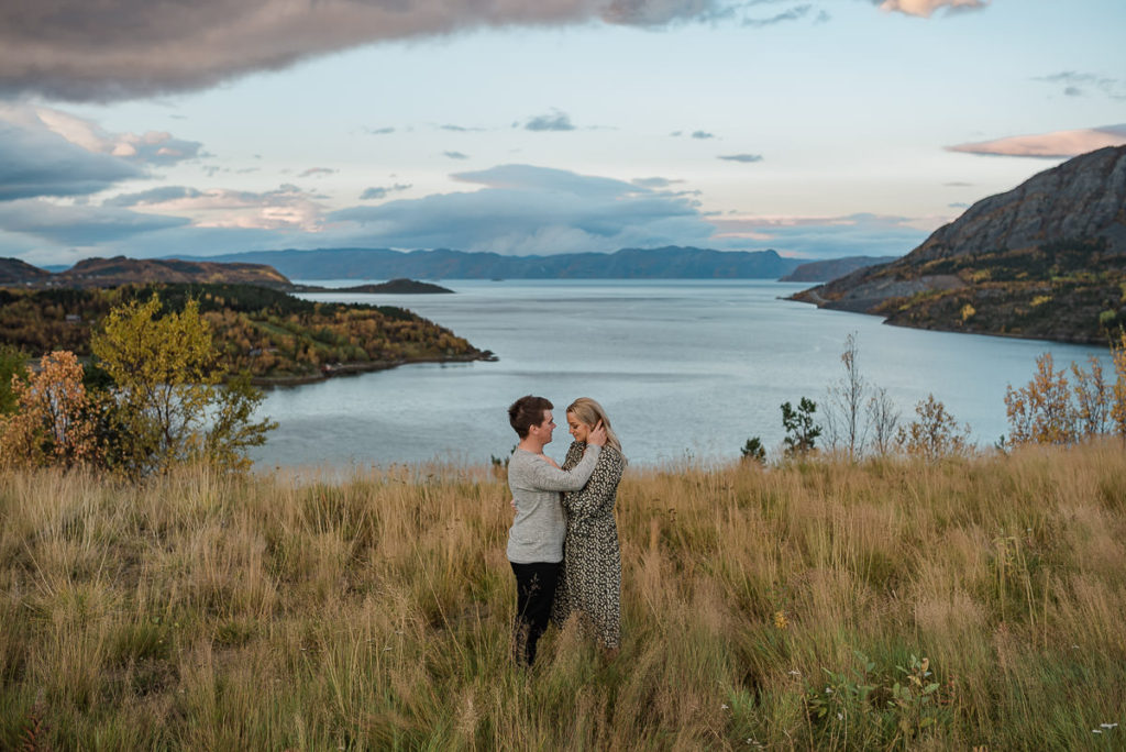 Norway elopement photographer captured a beautiful couple in front of a stunning sea view
