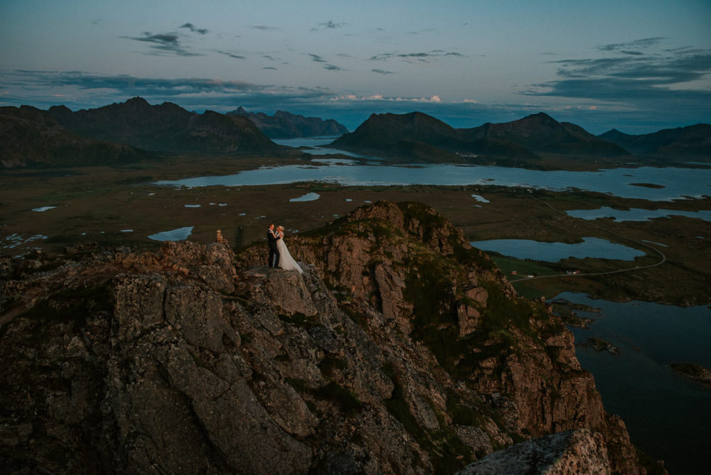 Bride and groom on a mountaintop in Lofoten on the day of their elopement