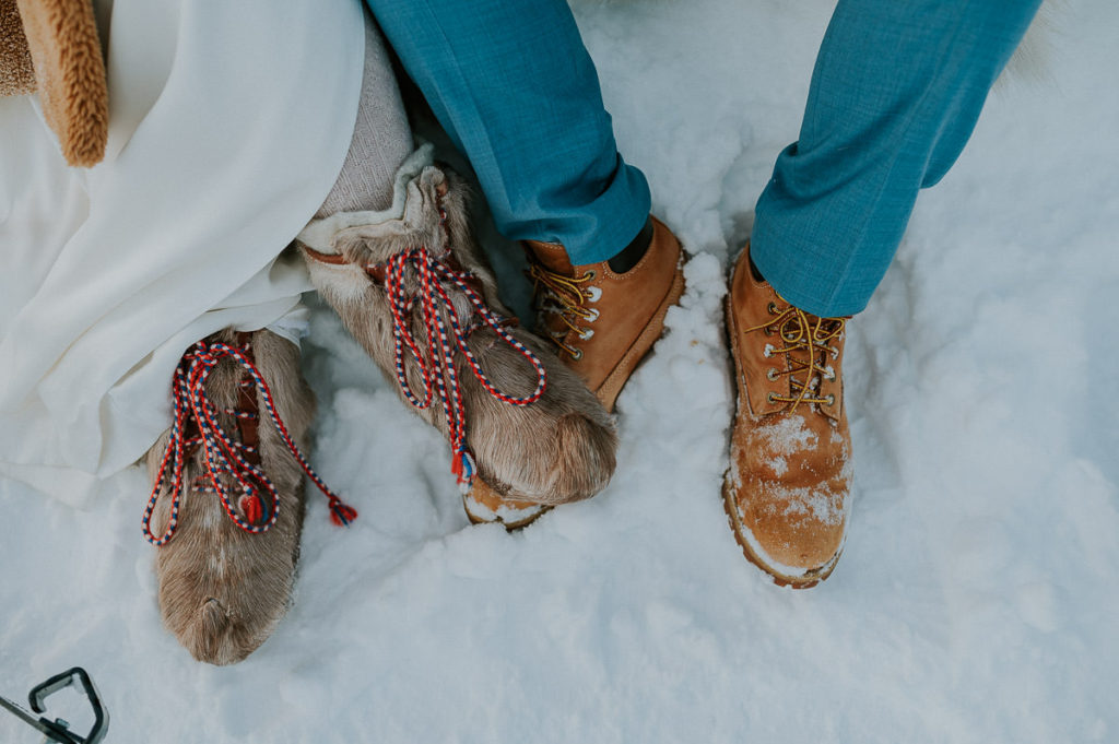 Sami and nordic inspired winter wedding theme in Norway - bride is wearing sami boots 