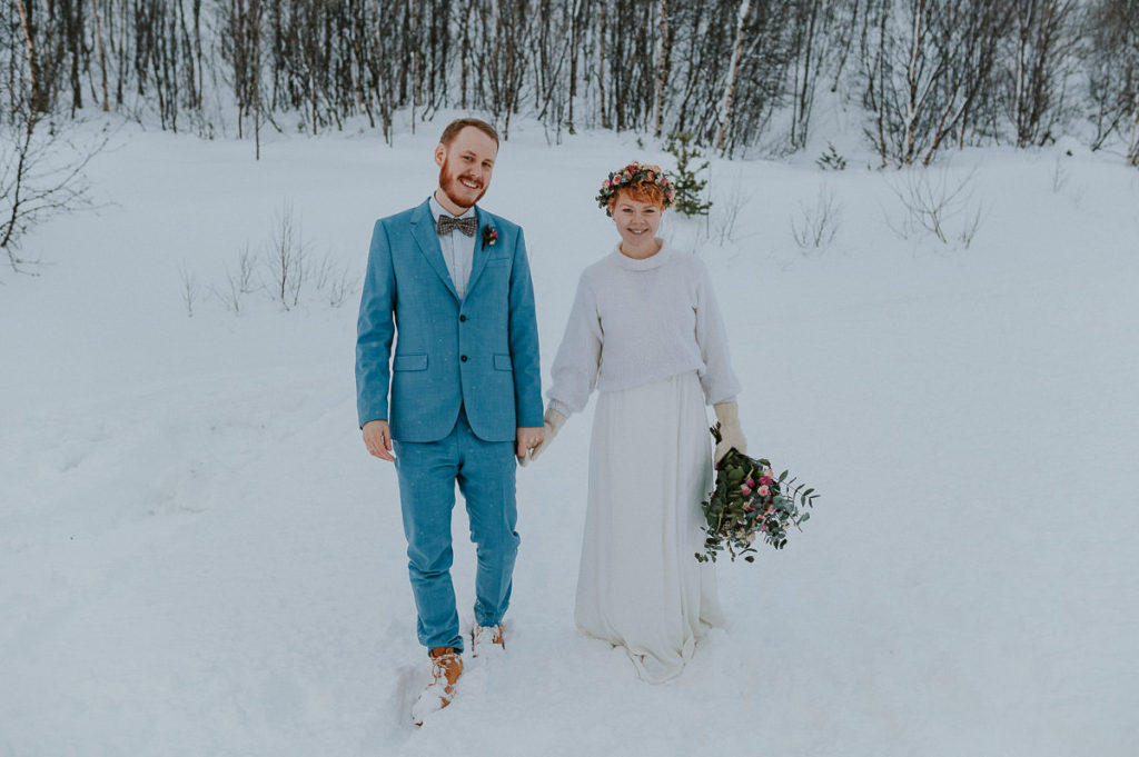 Bridal couple eloping in Norway in winter time