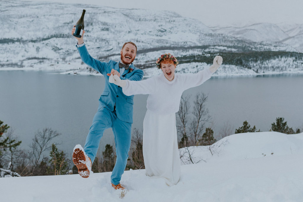 Just married - happy bride and groom on the day of their intimate winter wedding