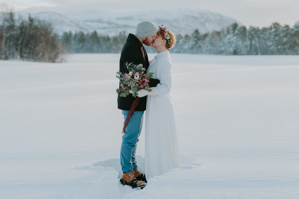 Eloping in Norway in winter time may be cold and require wearing snowshoes, but creates magical backdrops for your amazing elopement