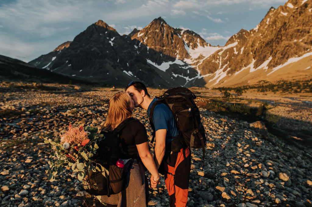 Bride and groom kissing each other and getting ready for their pre-wedding in Norway  - Lyngen Alps