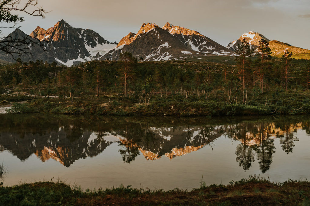 Beautiful midnight sun landscape in Lyngen Alps in Norway