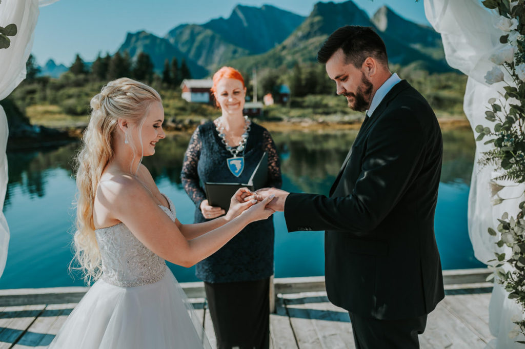 Ring exchange during outdoor wedding ceremony in Kabelvåg Lofoten
