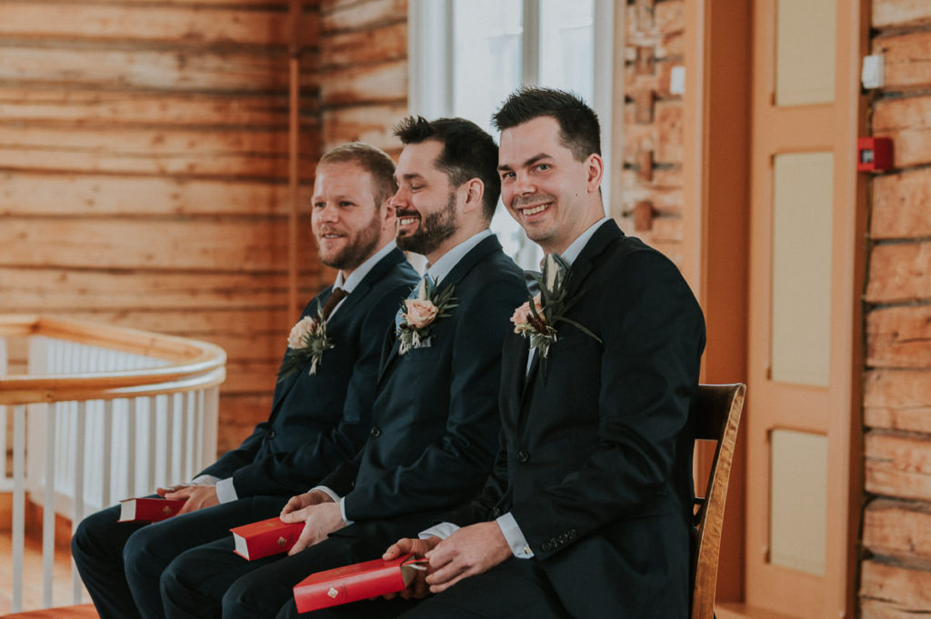 The groom and the groomsmen waiting for the bride in Hillesøy church in Tromsø  - by Tromsø wedding photographer TS Foto Design