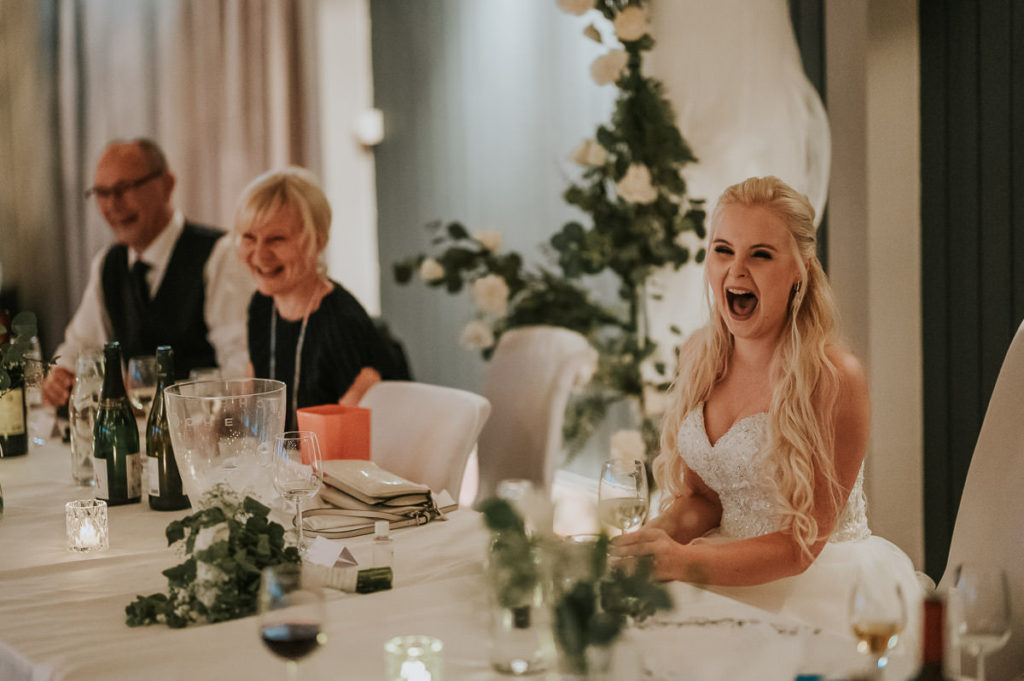 Wedding party at a Nyvågar rorbu hotel in Lofoten. Guests are having good time and laughing all the time