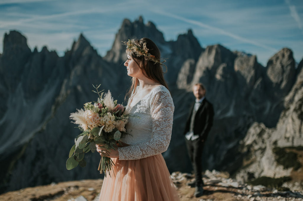 Bride and groom portraits among beautiful landscapes of Italian Alps 