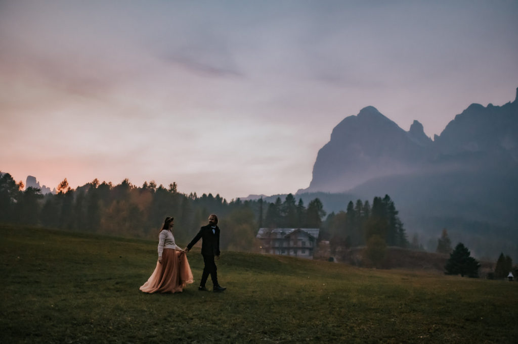 Bridal portrait in front of a pink purple sky in Italy