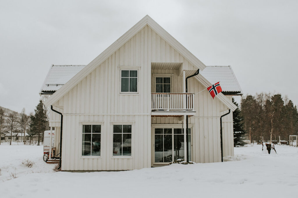 A wooden house in a norwegian winter landscape
