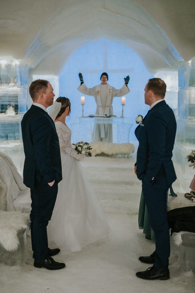 Winter wedding ceremony in the ice igloo hotel Sorrisniva in Alta Norway 