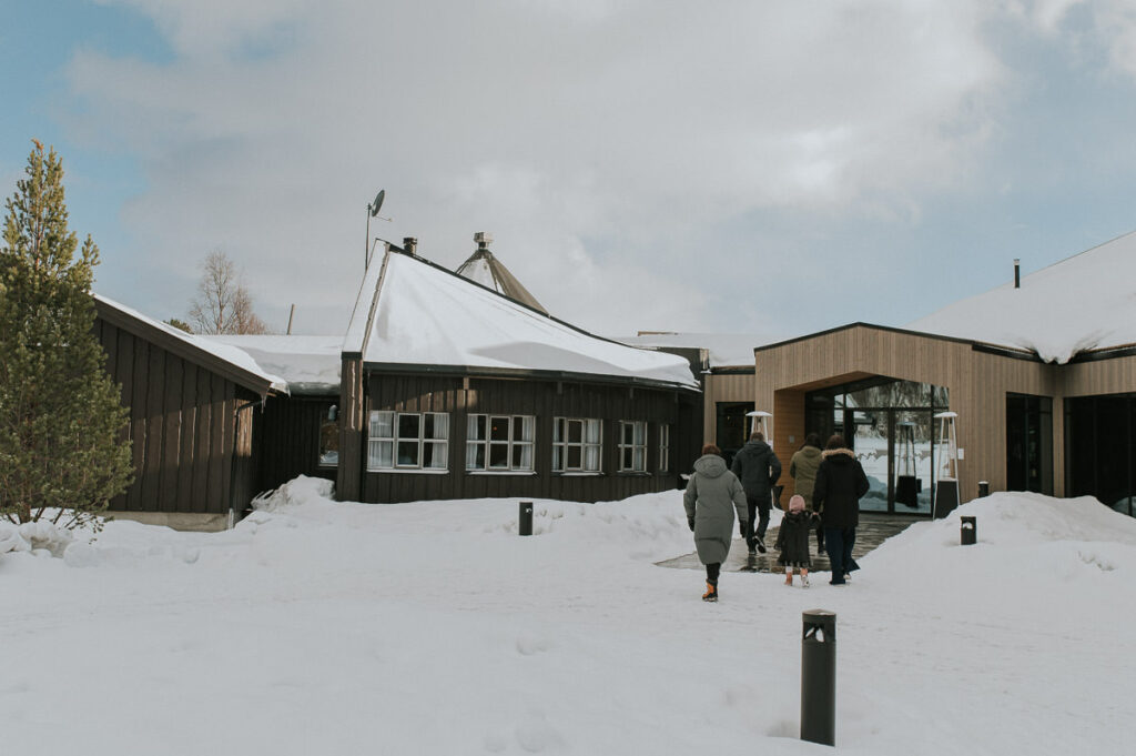 Wedding guests are walking in to Sorrisniva wilderness lodge in Alta Norway