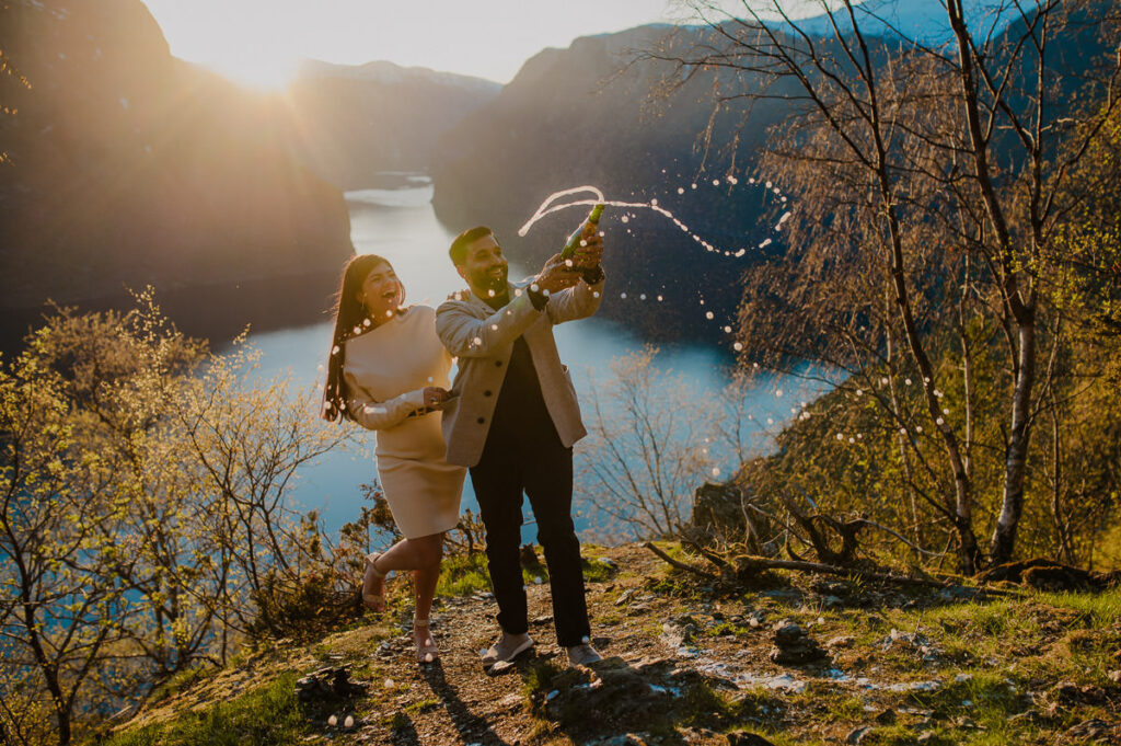 Beautiful couple popped up champagne by the fjord in Norway to celebrate their engagement