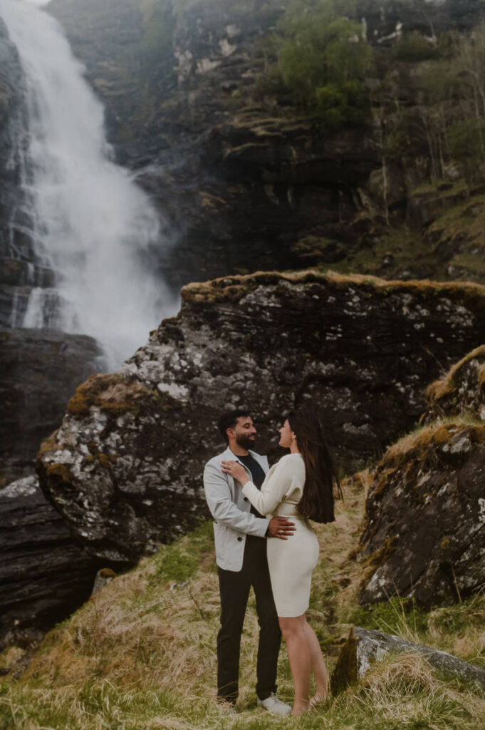 Adventure engagement couple session by the waterfall in Norway