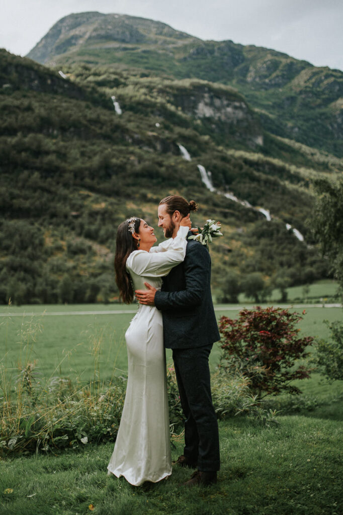 Bride and groom kissing outdoors after the first look on their elopement day in Loen, Norway