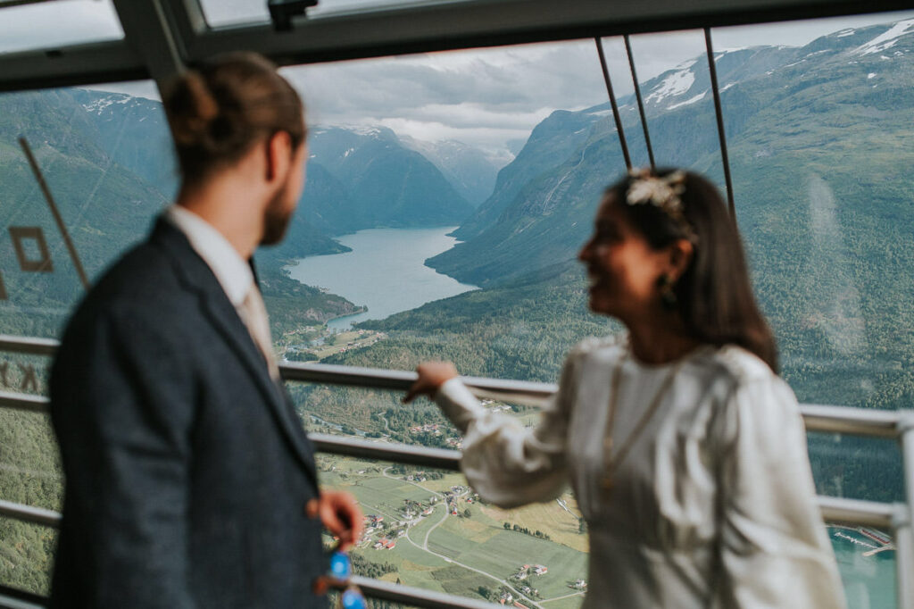 Bride and groom taking Loen Skylift up to the mountains on the day of their elopement in Loen