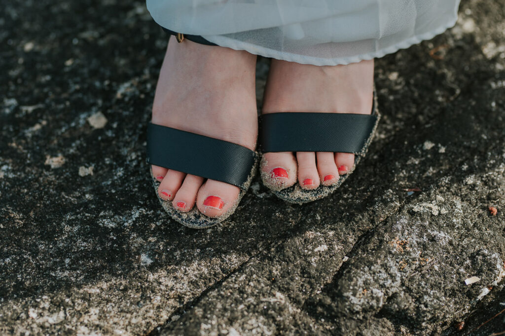 Bride got her toes all sandy after their elopement ceremony on a beach