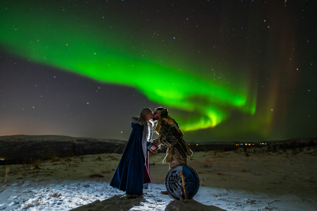 Viking style wedding anniversary photo session under the northern lights in Alta Norway