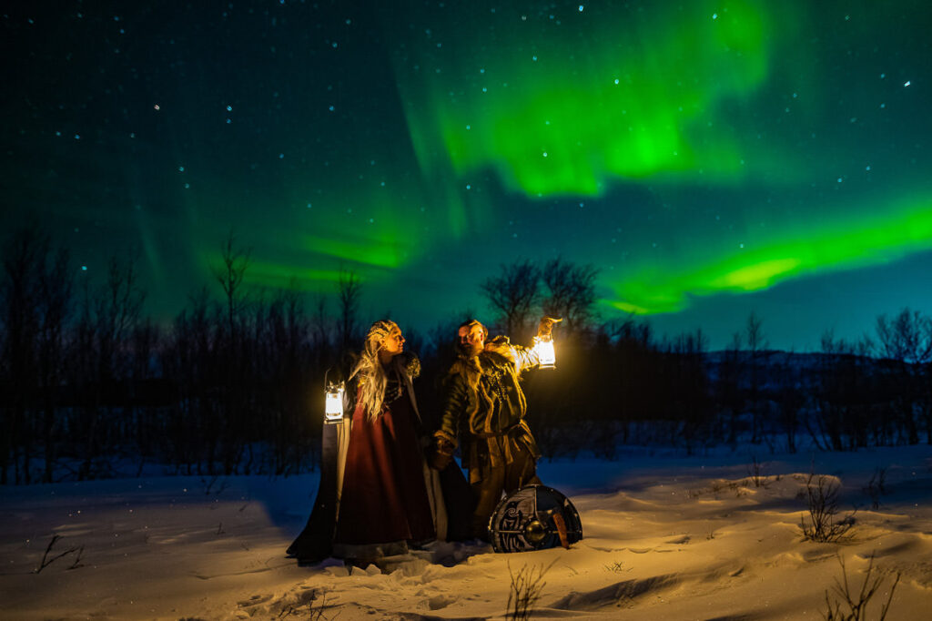 Viking style wedding anniversary photo session under the northern lights in Alta Norway