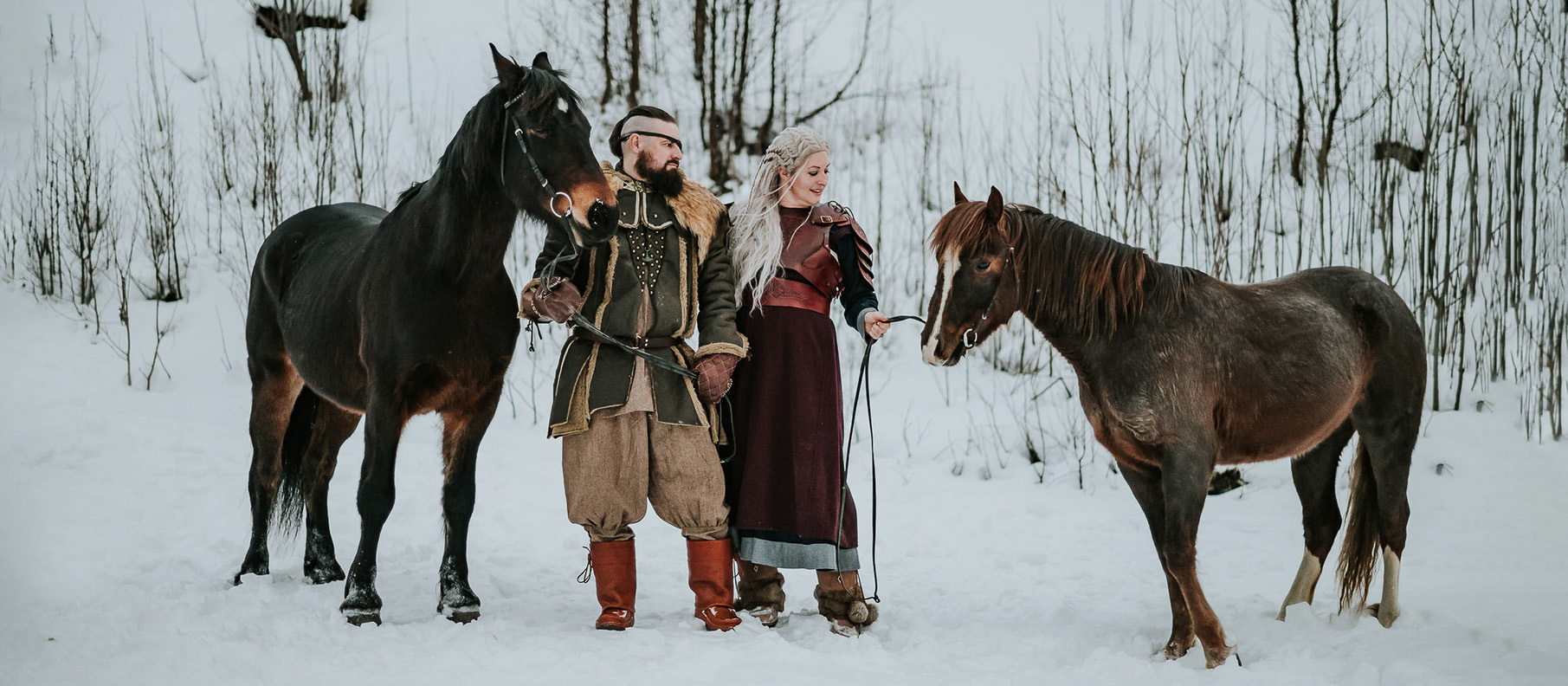 Viking couple with horses in a beautiful winter ladscape in Alta Norway