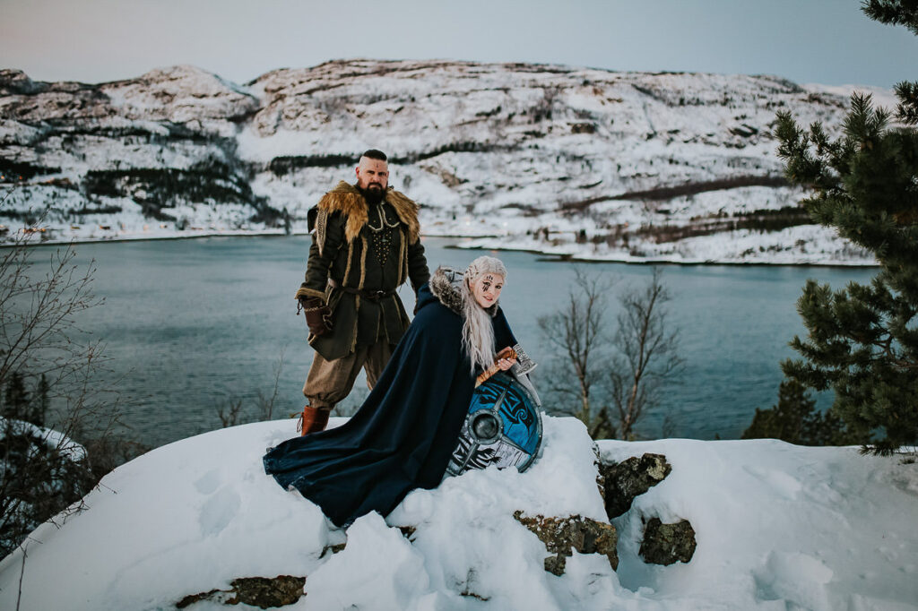 Viking style wedding anniversary photo session among norwegian winter landscapes