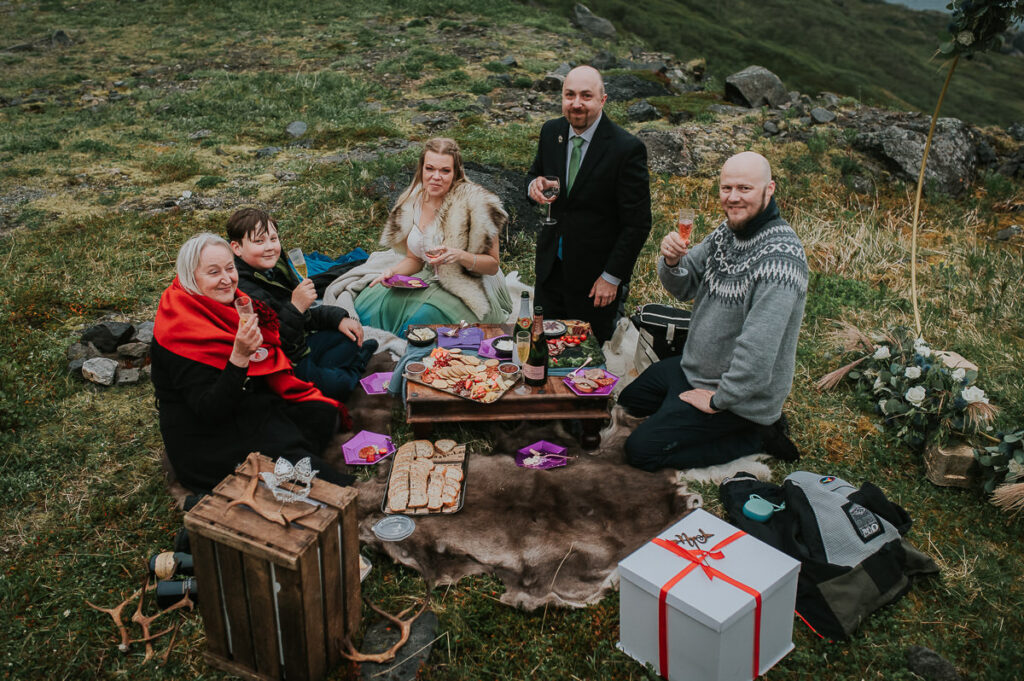 Midnight sun elopement picnic on Sørøya island in Northern Norway