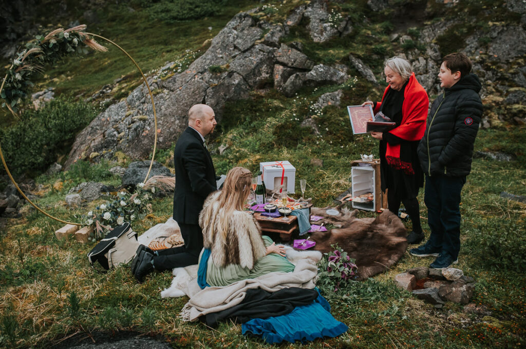 Midnight sun elopement picnic on Sørøya island in Northern Norway