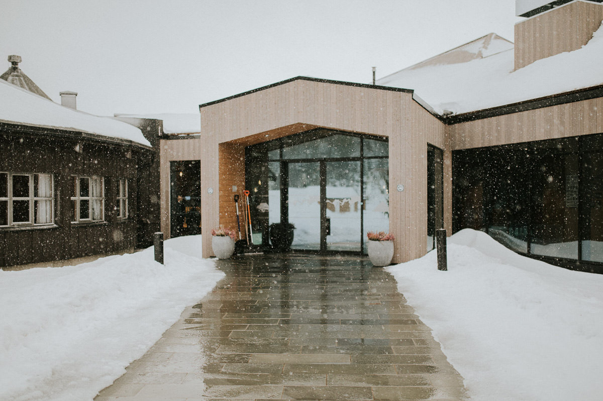 Entrance to the mountain lodge Sorrisniva in Alta Norway on a winter day under a snowfall