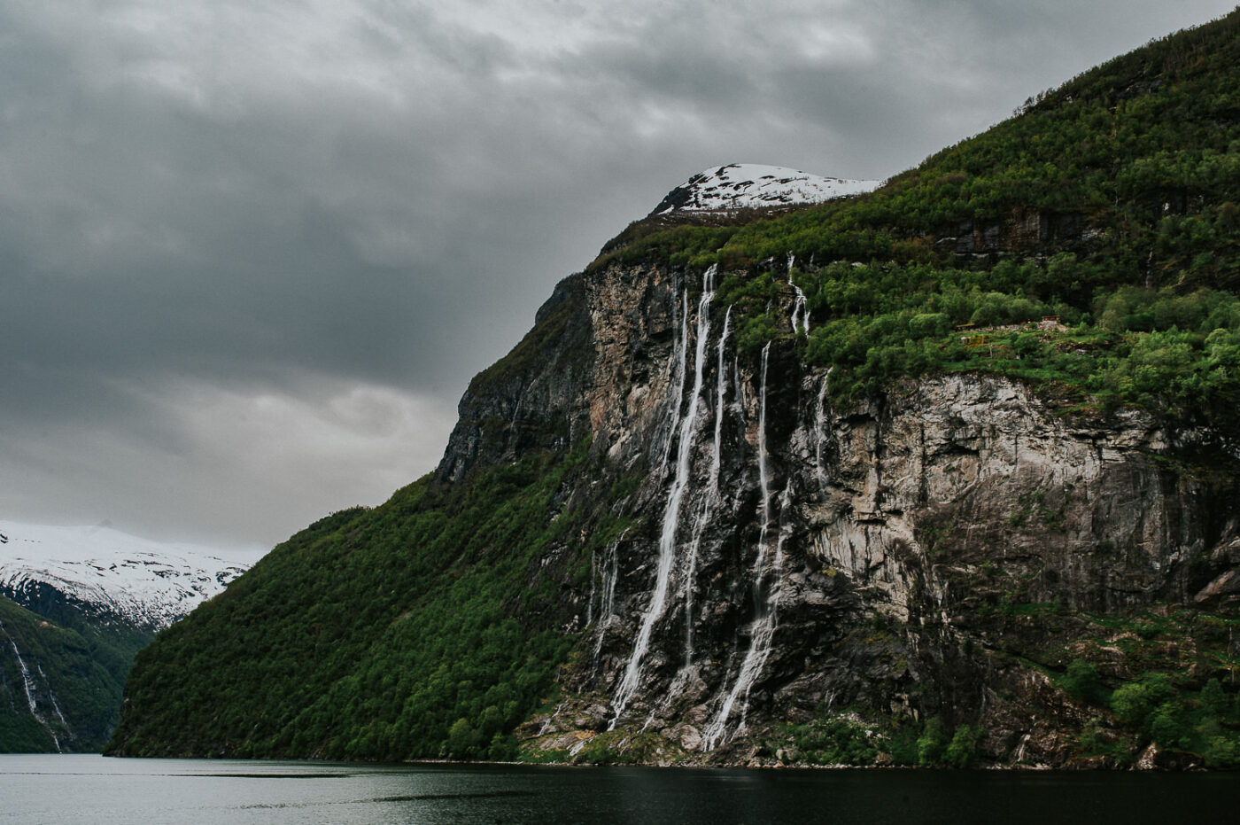 Dramatic view over Geirangerfjord and waterfalls in Western Norway - captured by photographer TS Foto Design