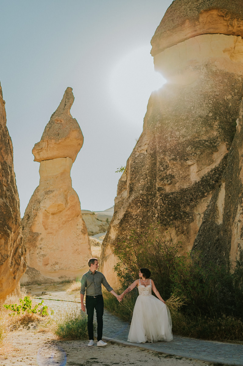 Bride and groom walking in Love Valley on the day of their Cappadocia elopement in Turkey