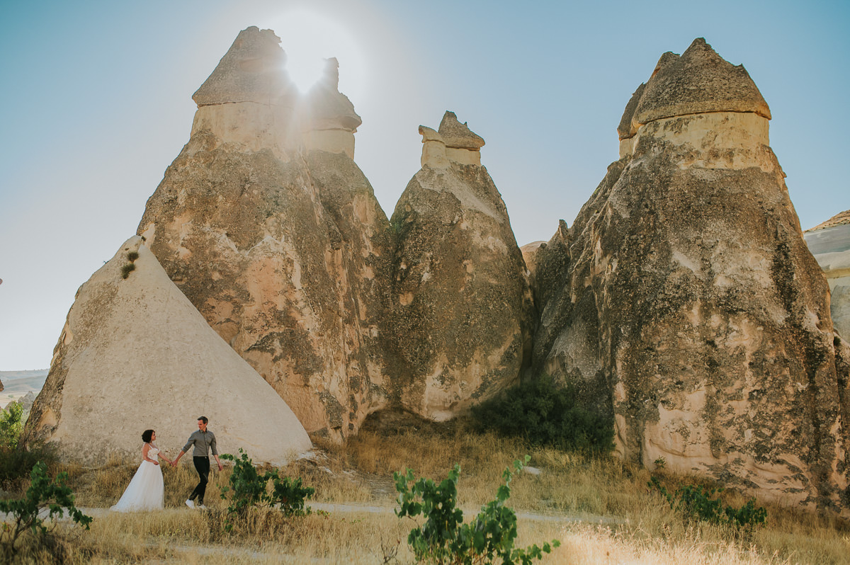 Bride and groom walking in Love Valley on the day of their Cappadocia elopement in Turkey