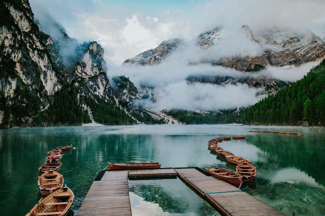 Iconic lake di Braies in morning mist on a nice September morning