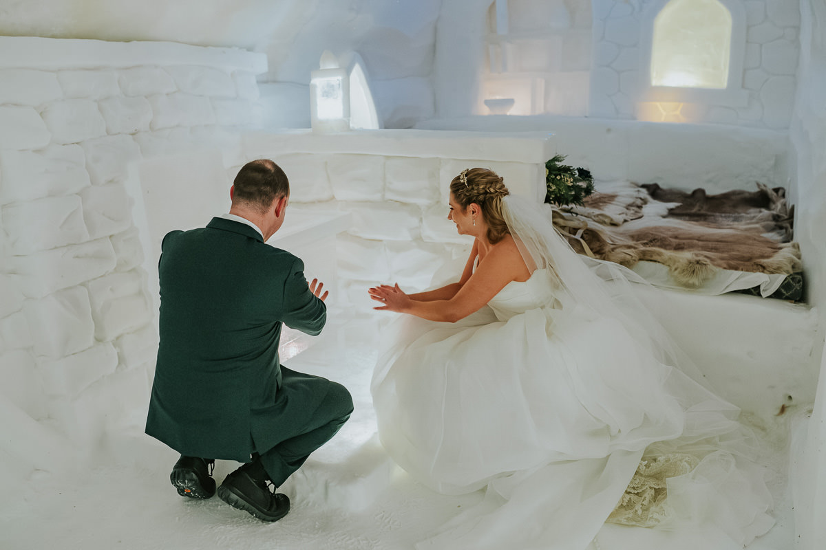 Bride and groom  in the igloo hotel Sorrisniva in Alta Norway