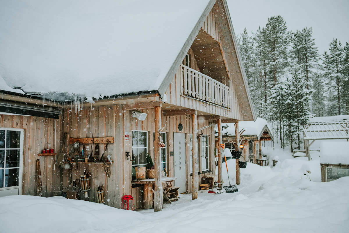 Cute old scandinavian house under a snowfall