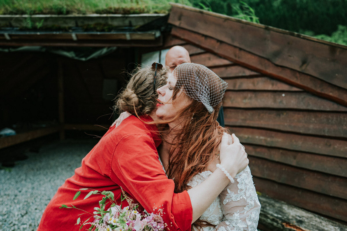 Bride and groom hugging their wedding guests