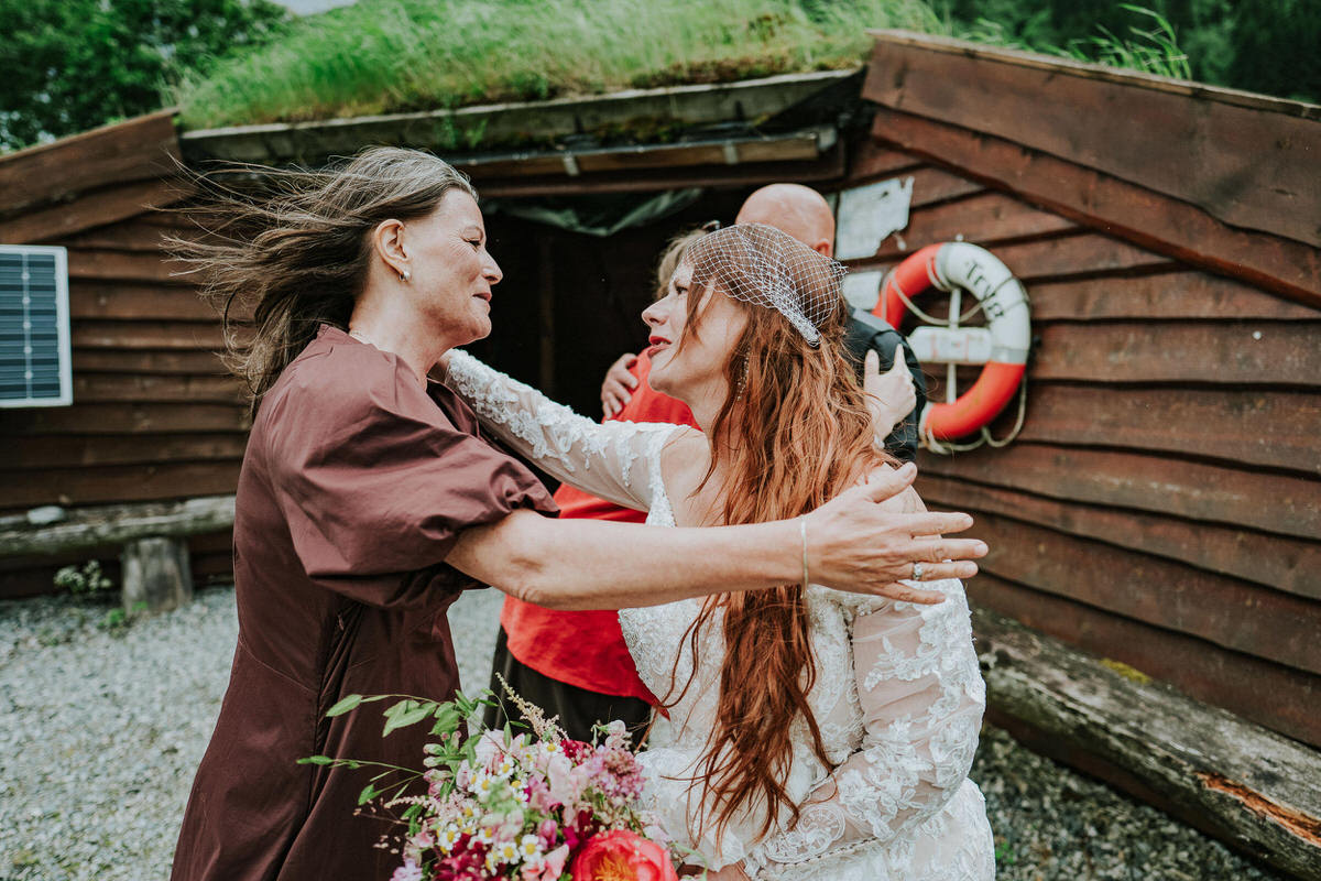 Bride and groom hugging their wedding guests