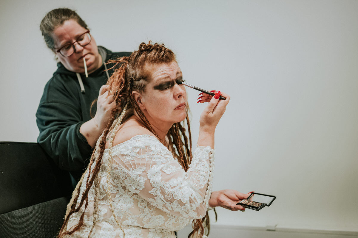 Bride doing her makeup and getting ready for her viking elopement in Norway