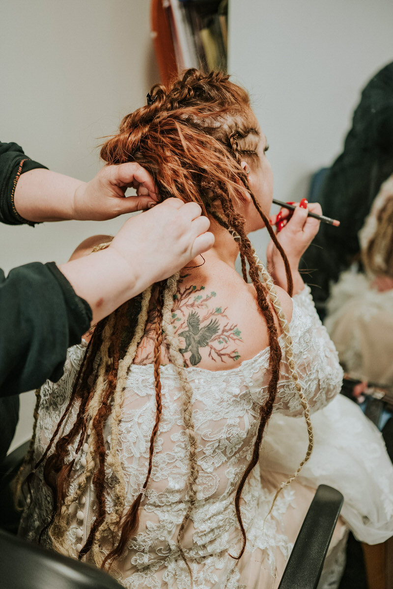 Bride getting her hair braided for her viking elopement in Norway