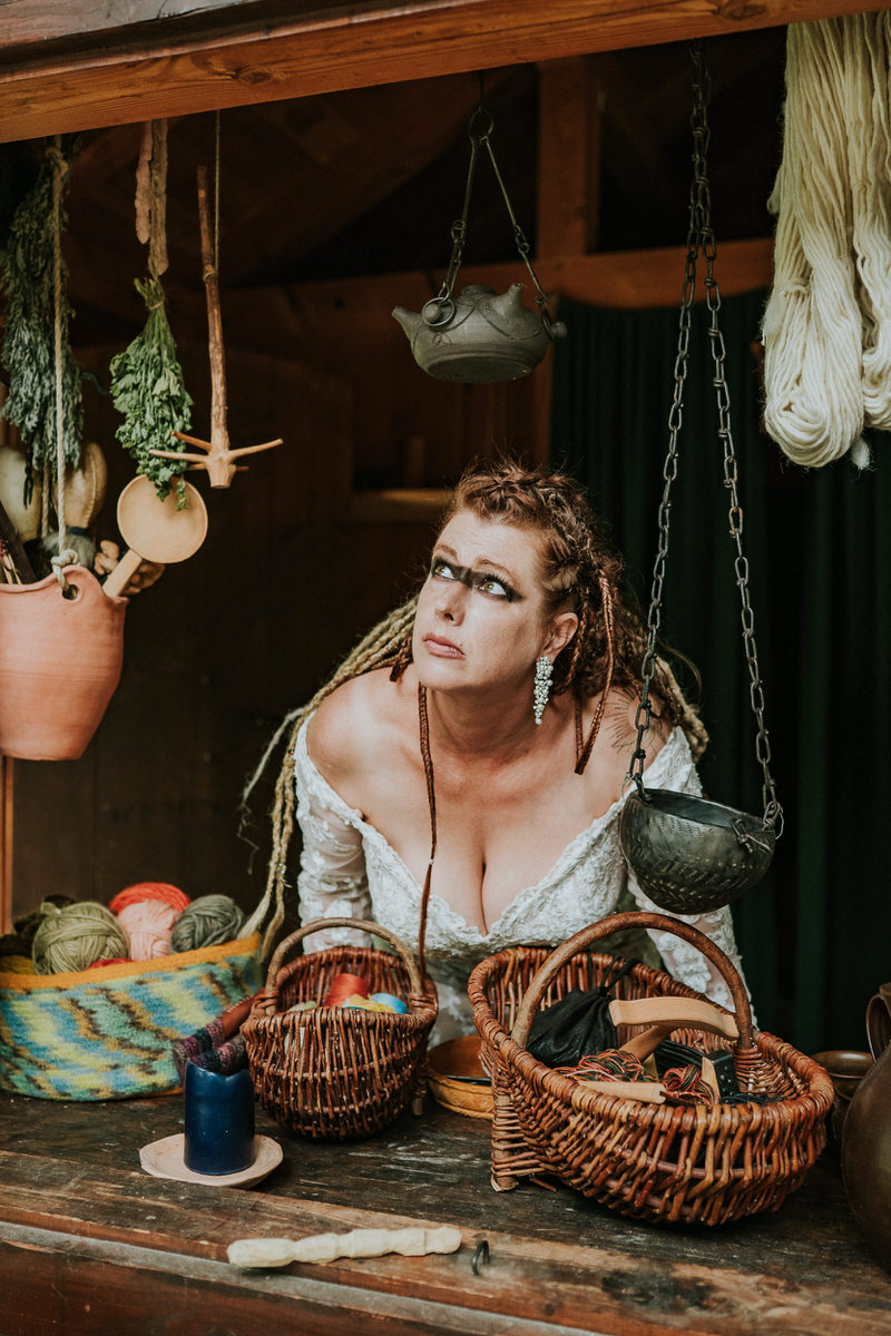 Viking bride looking through a window in Gudvangen viking village